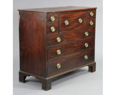 An 18th century inlaid mahogany secretaire chest with a fall-front fitted drawer to centre flanked by two short drawers eithe