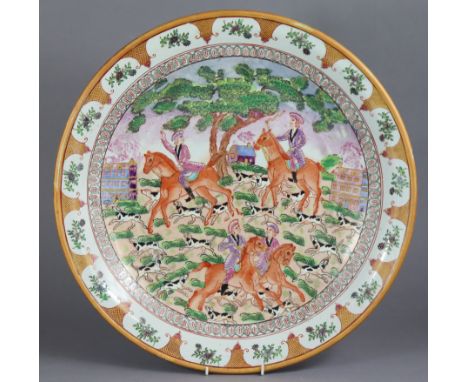 A Samson-type porcelain charger decorated with a European hunting scene in the 18th century Chinese Export style, faux six-ch