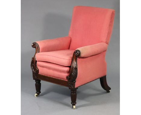 A William IV mahogany frame library armchair upholstered red fabric with loose cushions, carved scrolling arms &amp; reeded t