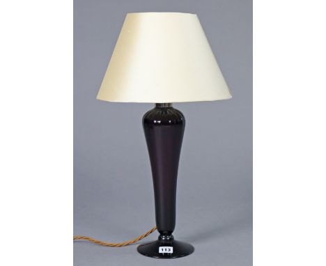 A 20th century Amethyst glass table lamp on fluted tapering slender column &amp; circular pedestal foot; 14” high, with shade