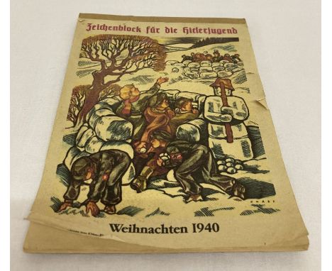 A German WWII style Hitler Youth sketch pad.  With several pages of pencil sketches. 
