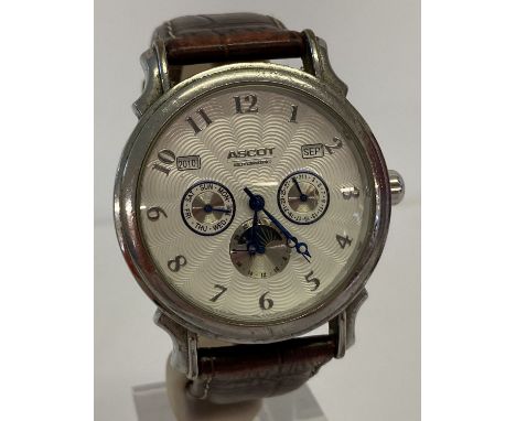 A men's chronograph automatic wrist watch by Ascot. White engine turned face with blue steel hands.  Brown leather strap in w