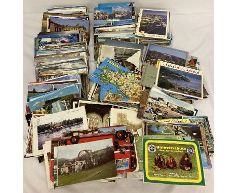 A large collection of vintage and modern postcards to include destinations, churches and foreign.  