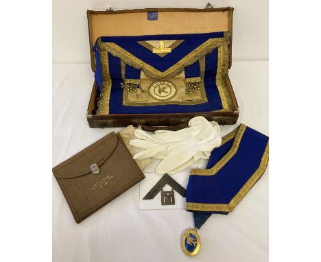 A vintage Masonic cowhide case containing a quantity of Provisional Regalia.  From Sussex Royal Pavilion Lodge. To include ap