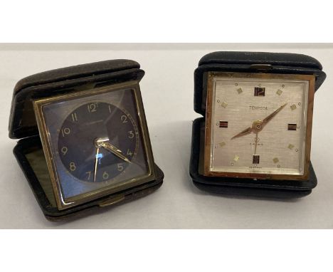 2 vintage German folding travel alarm clocks.  An Art Deco Junghams clock with black face, bevel edged glass and leather case