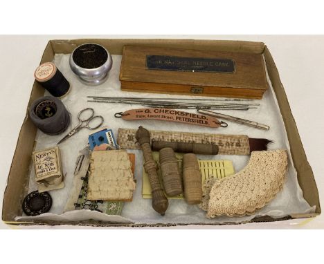 A collection of assorted vintage sewing accessories.  To include Morris &amp; Yeomans The National Needle Case and carved woo