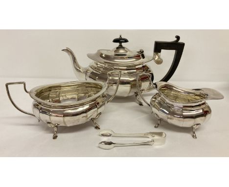 A Victorian silver plated matching teapot, sugar bowl and milk jug.   Together with a pair of silver plated sugar tongs marke