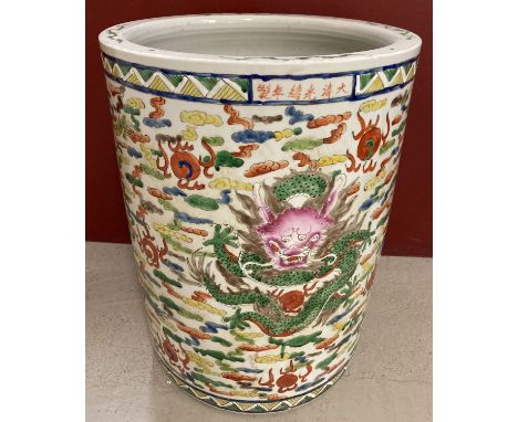 A large Chinese hand painted ceramic pot/planter, with dragon detail.   Approx. 49cm tall x 37cm diameter.