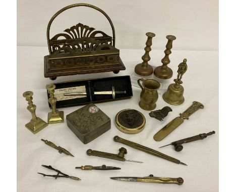 A small collection of vintage metal ware items, mostly brass.  To include a vintage brass and wood letter rack on bun feet, m
