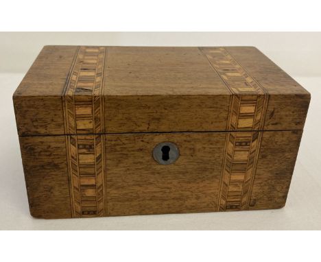 A small vintage wooden tea caddy with marquetry detail to lid and front.  2 lidded compartments to interior, one lid a/f.  Ap