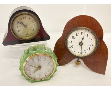 3 small vintage bedside clocks. A dark brown plastic cased clock with engine turned face.  Together with a 1960's green plast