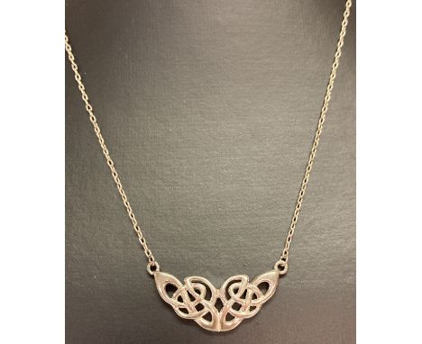 A Celtic design silver fixed pendant necklace. Marked 925 to chain clasp.  