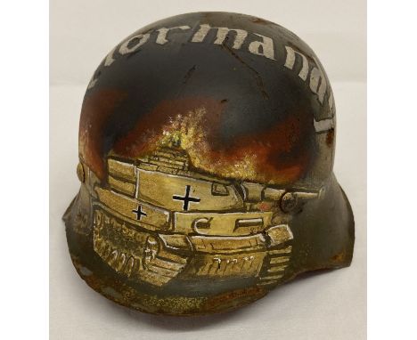 A WWII German M42 helmet with post war hand painted detail depicting a tank.  In memoriam to Normandy. 