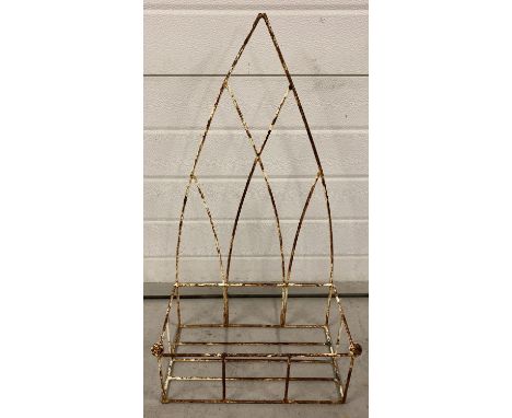A vintage white painted metal wall hanging planter with arch design back.   Approx. 75cm tall.