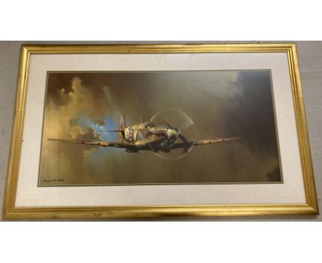 A large framed and glazed print of a spitfire in flight by Barrie A.F. Clark.   Frame size approx. 70 x 114 cm.