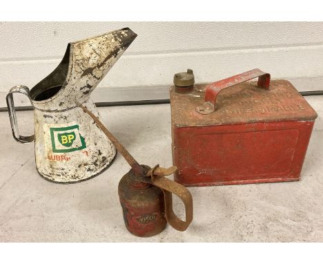 2 vintage oil cans; Westco and BP, together with a red painted half size vintage petrol can.  