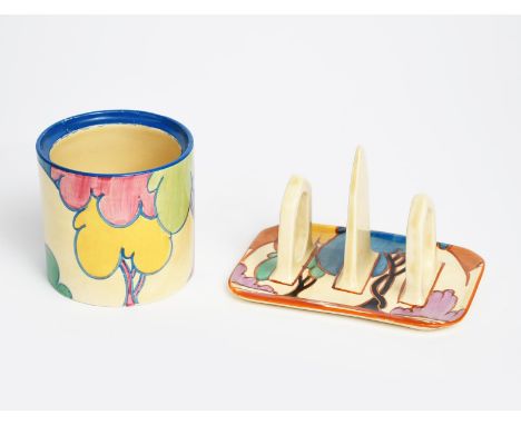 'Autumn' a Clarice Cliff Fantasque Bizarre toast rack, painted in colours,  and a  'Pastel Autumn' Cylindrical preserve pot, 