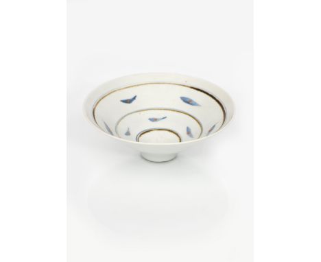 ‡ David Leach OBE (1911-2005) a porcelain conical bowl, painted with simple bands of fish motif in blue and iron red on a pal