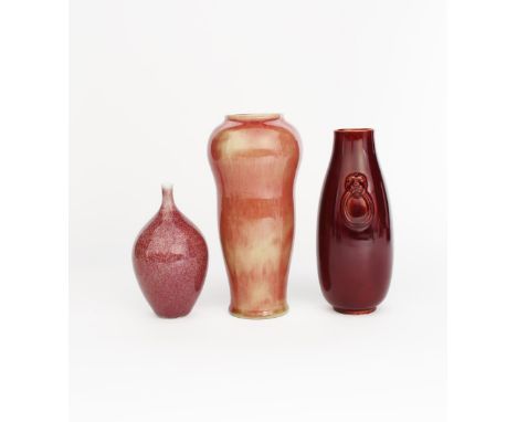 A Salopian Ware vase, the slender vase with applied mask handles, covered in a rich flambe glaze, a Royal Doulton stoneware v