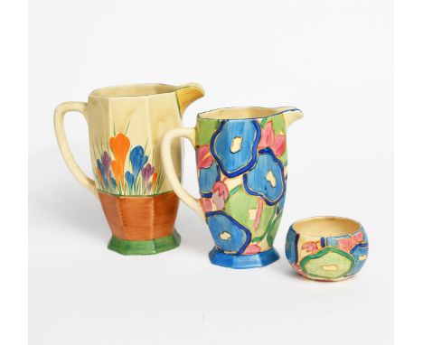 'Crocus' a Clarice Cliff Bizarre large Athens jug, painted in colours, a Clarice Cliff 'Blue Chintz' Athens jug and a small o