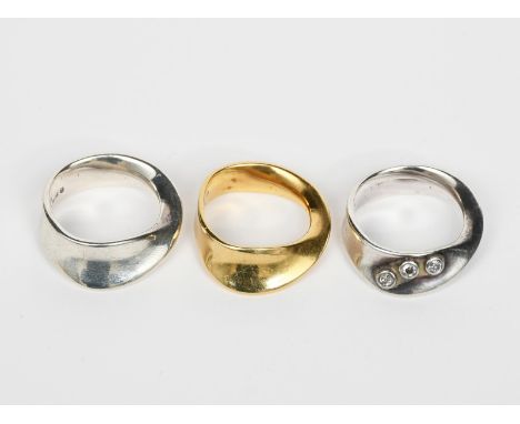 A Georg Jensen 18ct gold Moebius ring designed by Vivianna Torun Bulow-Hube, model no.900, another Georg Jensen silver ring m