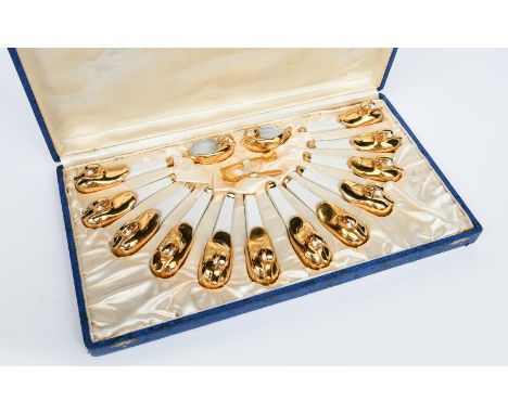 A cased set of twelve Robj ceramic knife-rests and two salts,  each modelled as a duck, white highlighted with gilt, in fitte