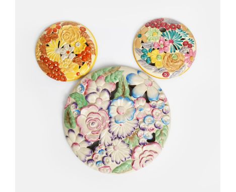 'Flora' a  Clarice Cliff large wall plaque, moulded in relief and pierced with flowers and foliage, in colours and two small 