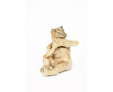 A Martin Brothers stoneware Imp Musician by Robert Wallace Martin,  modelled seated playing the pan pipes, covered in a mushr