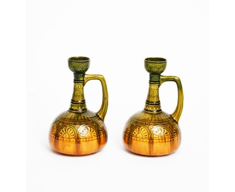 A pair of Ault Pottery jugs designed by Dr Christopher Dresser,  ovoid body with cylindrical neck and swollen rim, cast in lo
