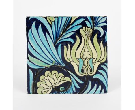 A William De Morgan Late Fulham Period Persian tile, painted with a flower and foliage design in green, blue and turquoise, i