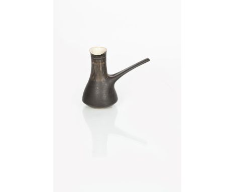 ‡ Dame Lucie Rie (1902-1995) a stoneware pourer in a manganese glaze with sgraffito band to neck, off white glaze  to interio