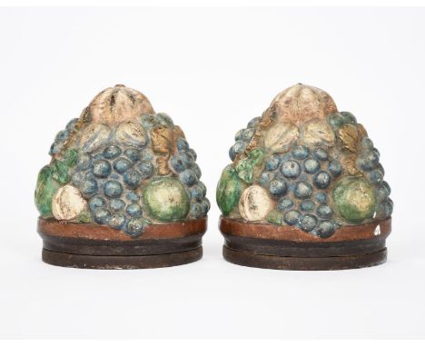 A pair of Potter's Art Guild Compton Pottery book ends,  each modelled as a cluster of fruit, with applied metal tops, unsign