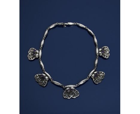 A Georg Jensen silver and amethyst necklace, model no.4, five panel cast  with stylised butterfly motif, set with two amethys