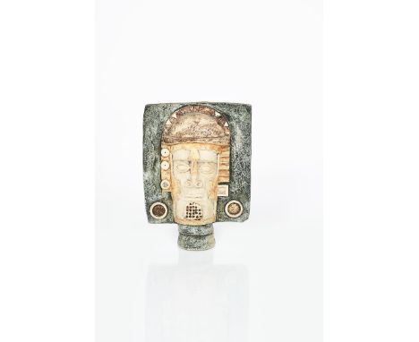 A rare Troika Pottery mask by Alison Brigden,  cast in relief to one side with Aztec face, the other a geometric mask design,