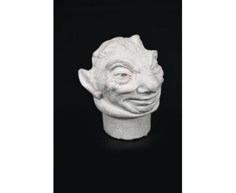 A Martin Brothers grotesque head by Robert Wallace Martin, dated 1906, modelled with mischievous smile,  unglazed, incised R 