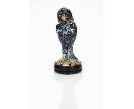 A Martin Brothers stoneware bird jar and cover by Robert Wallace Martin, dated 1913,  the small finch-like bird modelled stan