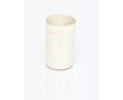 ‡ Dame Lucie Rie (1902-1995) a stoneware beaker vase, covered in a pitted off white  glaze, impressed seal mark 11.5cm. high 