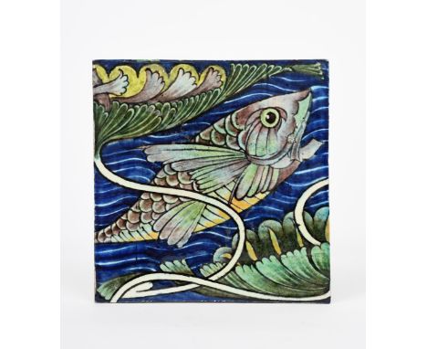 A William De Morgan Sand's End tile, painted with a leaping scaly fish swimming in a river, with an Art Nouveau water lily pa