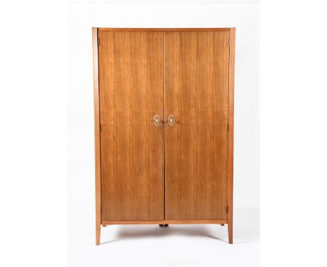 A Gordon Russell Kingcombe Indian Laurel and mahogany double wardrobe designed by W H Russell, model no. R.532, with internal