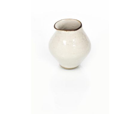 ‡ Dame Lucie Rie (1902-1995) a small stoneware pourer, covered to the foot with a pitted, silver grey glaze, impressed seal m