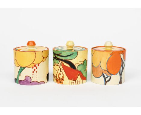'Orange Autumn' a Clarice Cliff Fantasque Bizarre Cylindrical preserve pot and cover, painted in colours, a Clarice Cliff 'Su