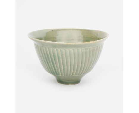 ‡ David Leach OBE (1911-2005) a Lowerdown Pottery fluted porcelain bowl, covered in a celadon glaze, impressed seal mark, 9.5