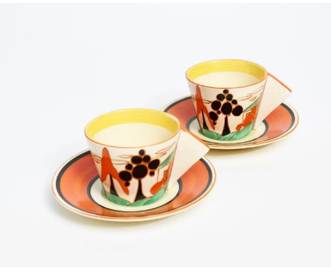 'Orange Trees and House' a pair of Clarice Cliff Bizarre Demi-tasse Conical cups and saucers, painted in shades of orange, gr