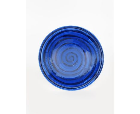 A Poole Pottery Arizona Blue  wall charger designed by Sir Terry Frost RA,  painted with a dark blue spiral on vivid royal bl