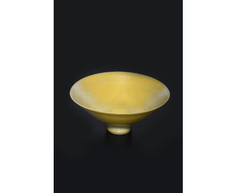 ‡ Dame Lucie Rie (1902-1995) a porcelain flaring conical bowl, covered to the foot in a yellow glaze, impressed seal mark, re