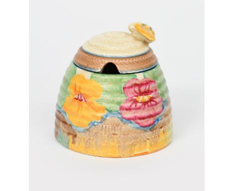 'Delecia Pansies' a Clarice Cliff Beehive Honeypot and cover, painted in colours printed factory marks, 10cm. high, (2) Prove