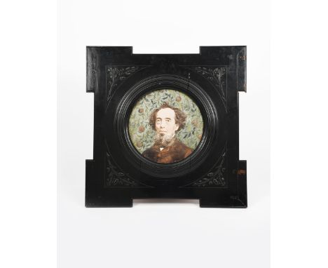 A large Douglas Ceramic Portrait roundel tile,  painted with a portrait of Charles Dickens, in colours, in ebonised wood fram
