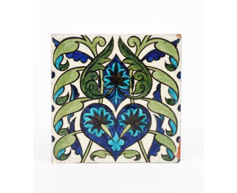 A William De Morgan Persian tile, on Poole Pottery blank, painted with flowers and foliage in blue, turquoise and green on a 