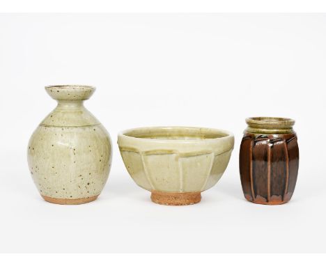 ‡ Richard Batterham (born 1936) a stoneware cut sided vase, shouldered form with flaring rim, covered in a pitted ash glaze, 
