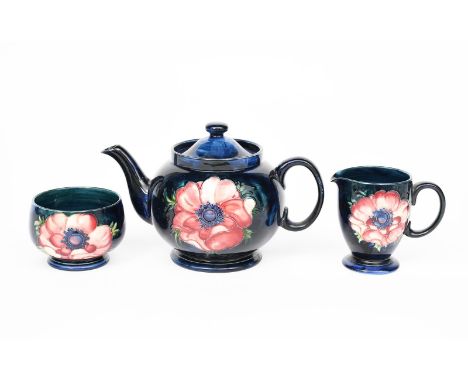 'Anemone' a Moorcroft Pottery tea set designed by Walter Moorcroft,  comprising teapot and cover, milk-jug and sugar basin, t